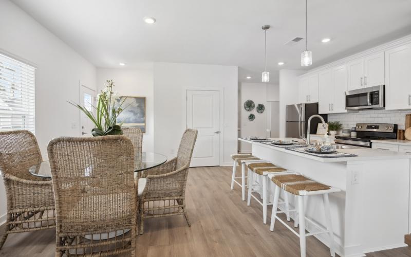 a kitchen with white cabinets