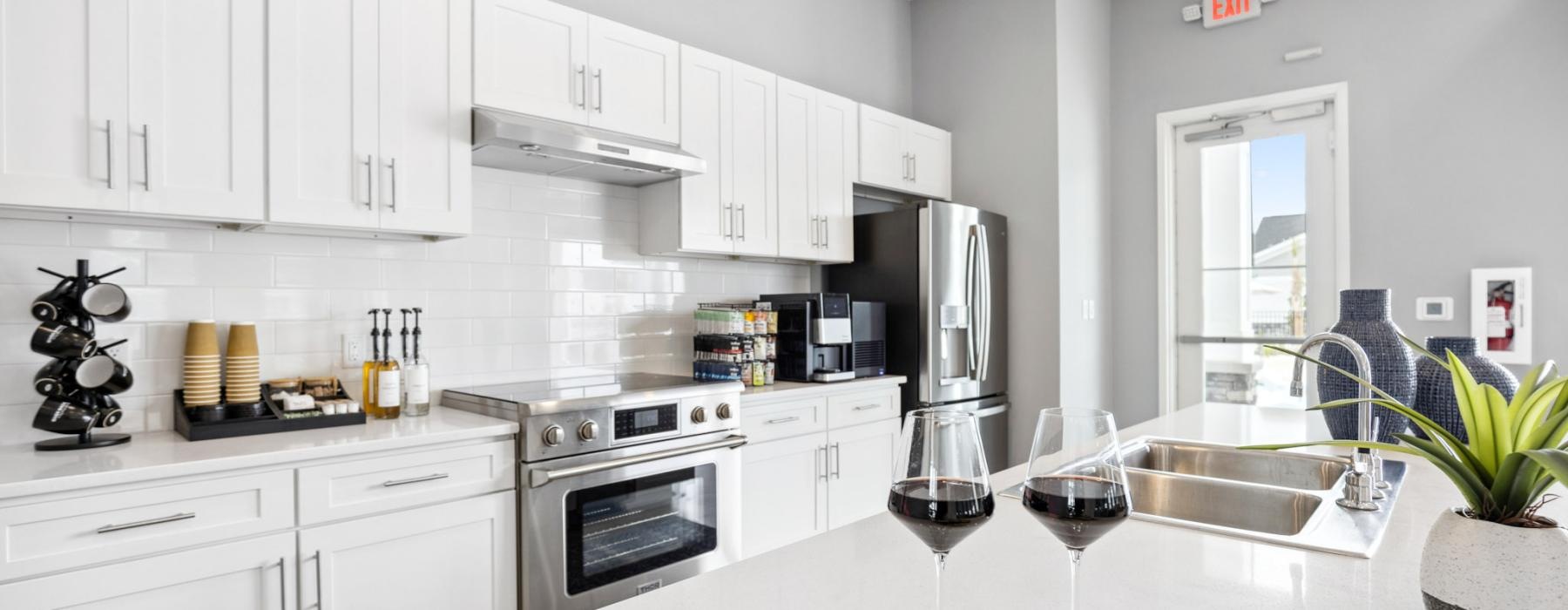 a kitchen with white cabinets