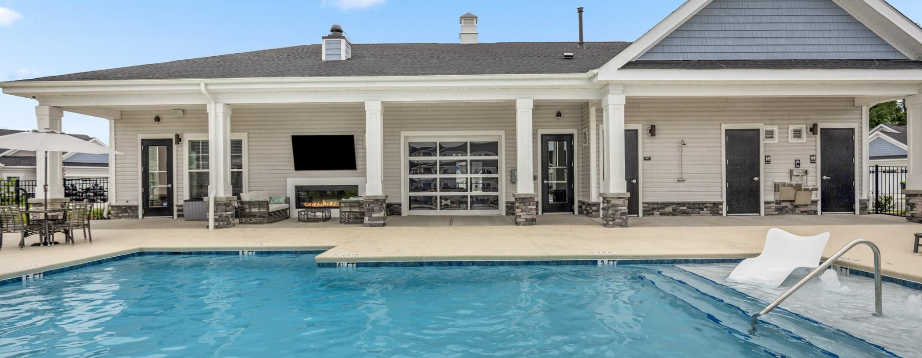 a swimming pool in front of a house