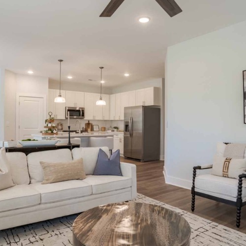 a living room with view of kitchen